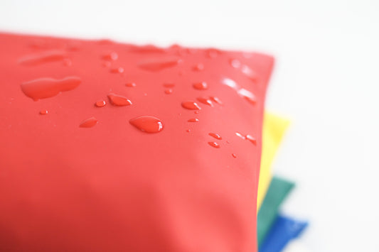 Wasserabweisende Outdoor-Kirschkernkissen Regenbogen