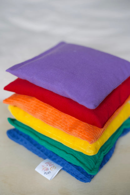 Sensorische Pittenzakjes in Regenboog kleuren. B2B - Pit and play